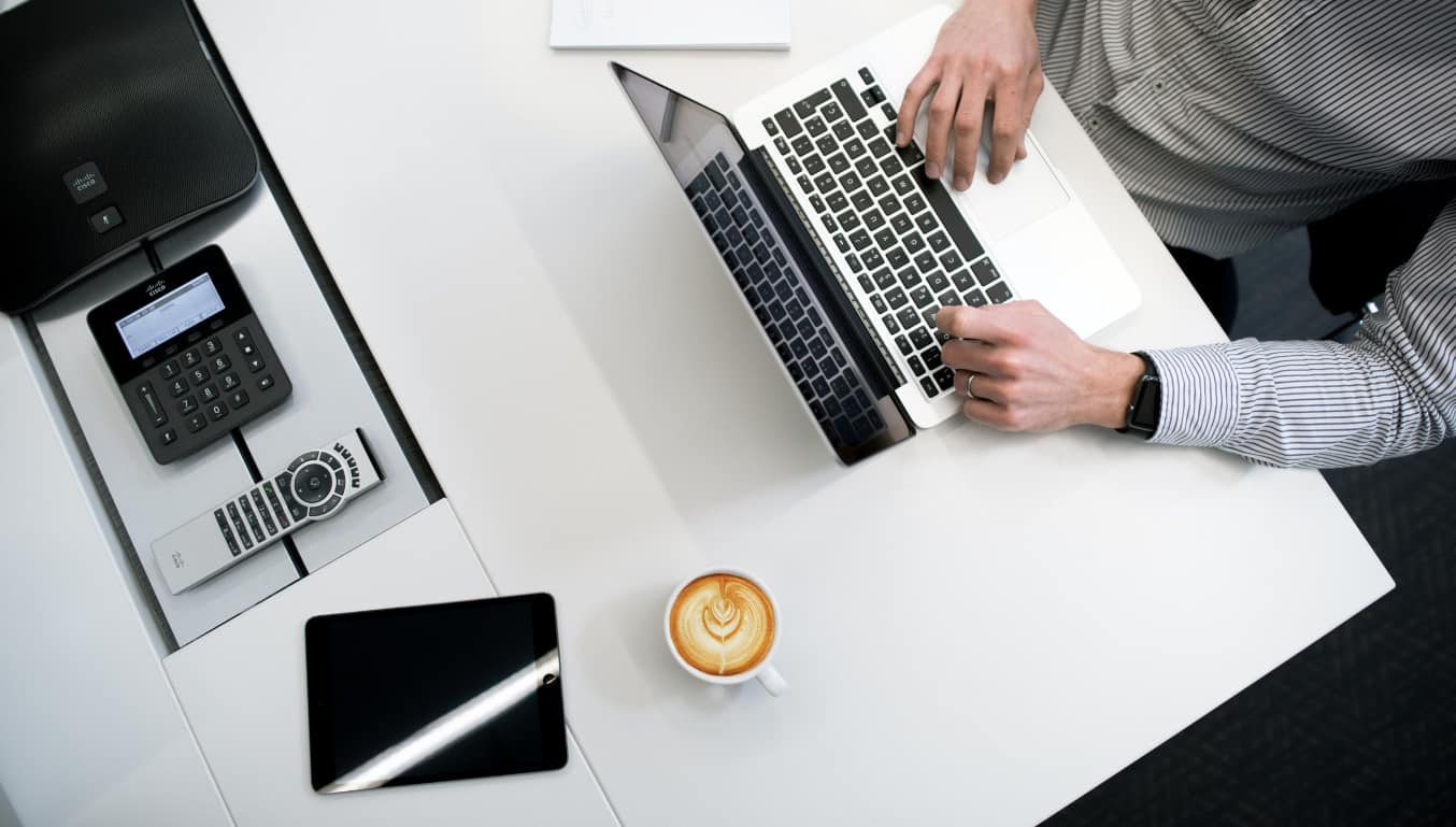 man-working-on-his-laptop-with-a-coffee