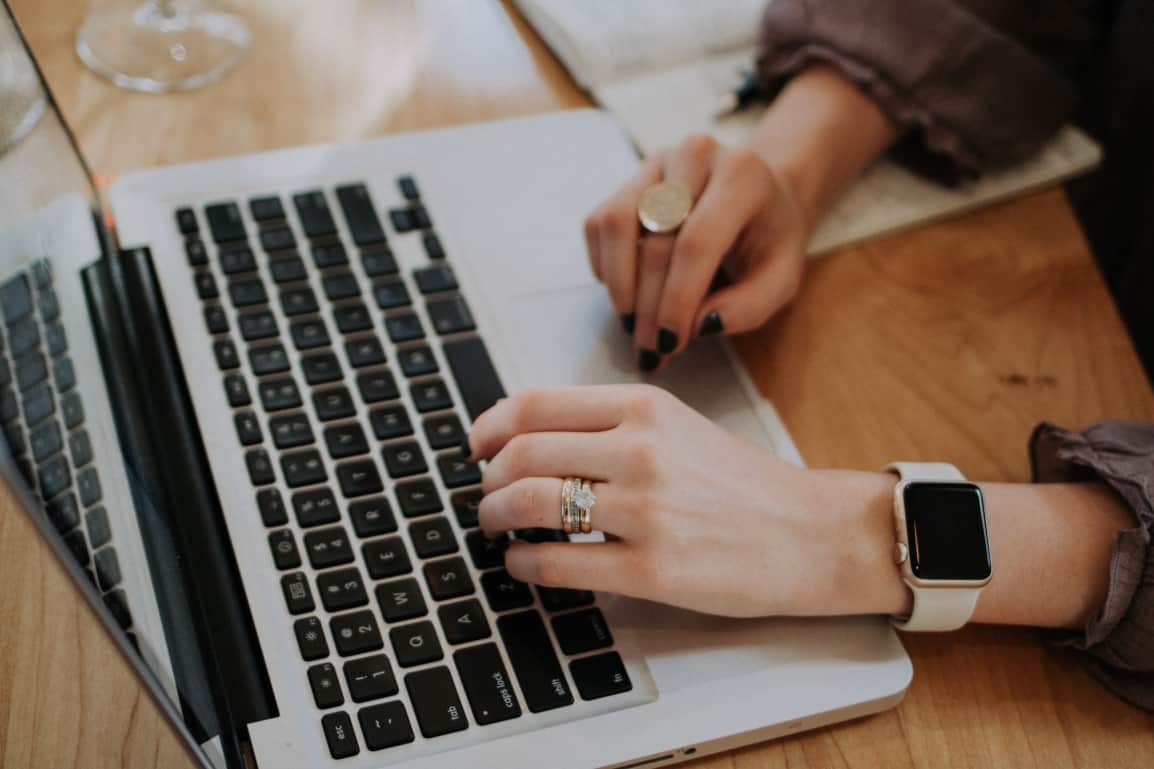 women-working-on-laptop-with-apple-watch-rings