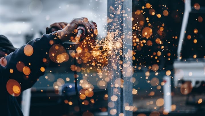 man-welding-steel-sparks-flying
