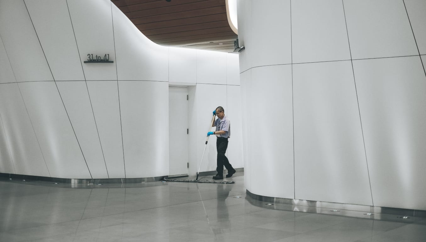 cleaner-sweeping-office-floors