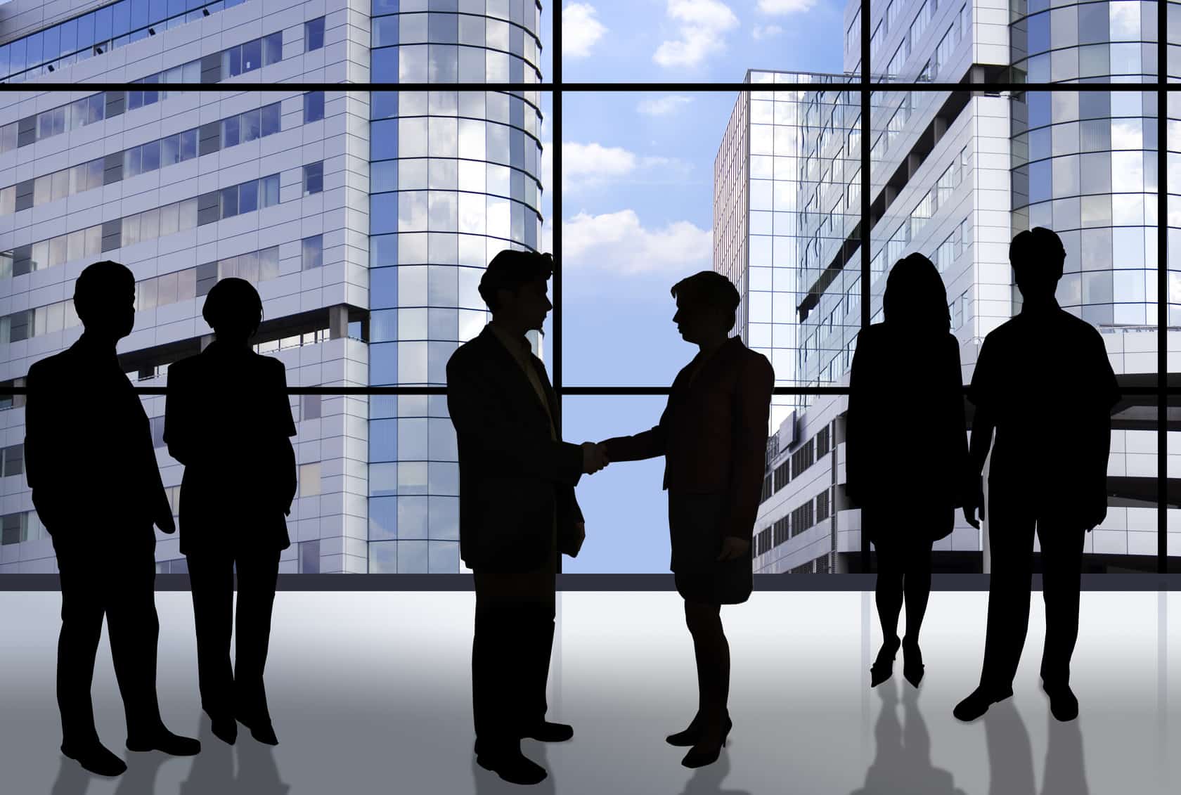 business people in front of an office window