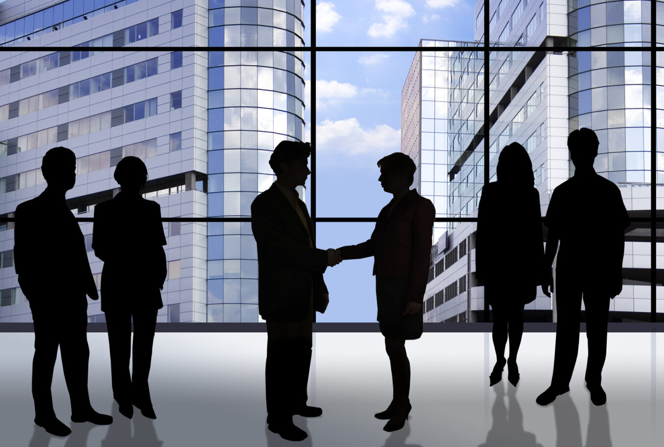 business people in front of an office window