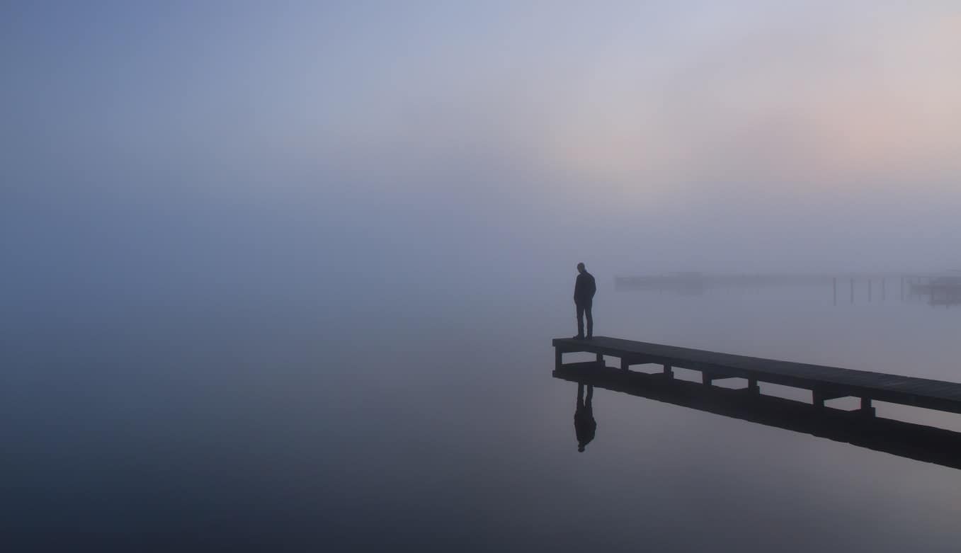 man-on-foggy-bridge