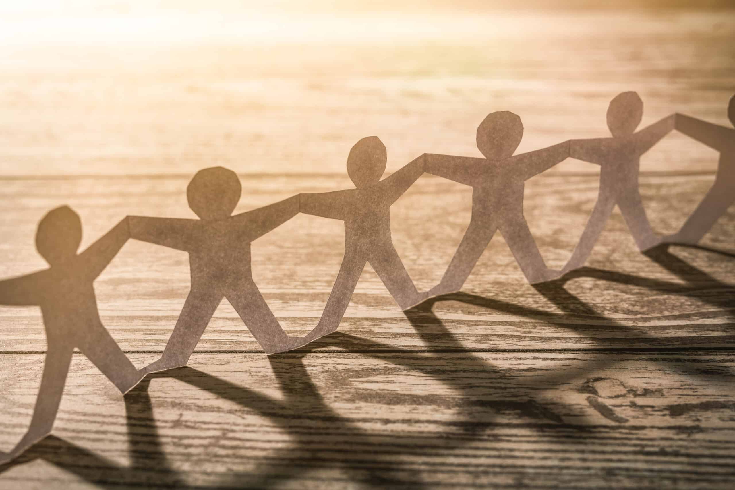 Human team of paper chain people