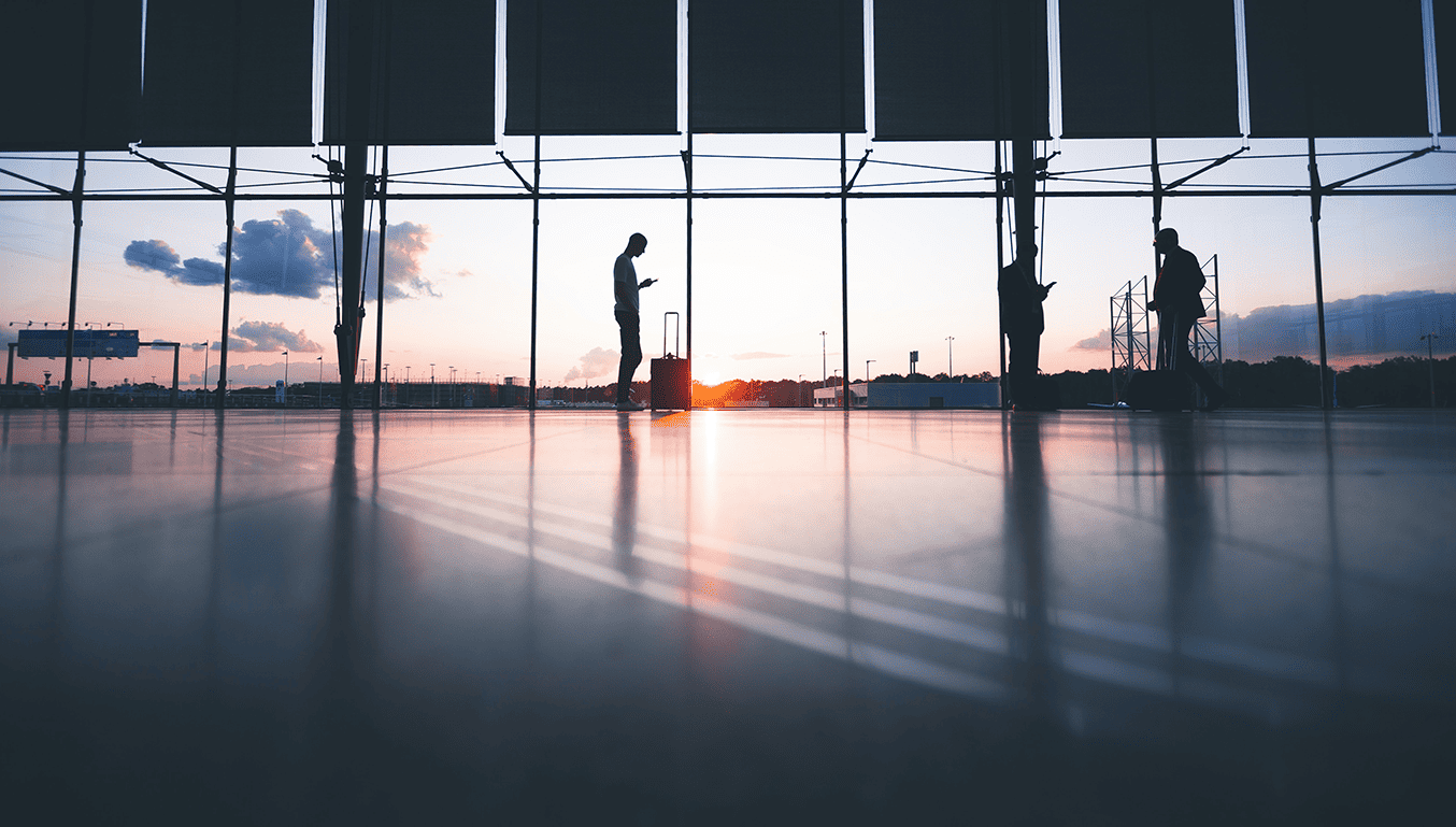 passengers-at-the-airport-with-the-sun-setting