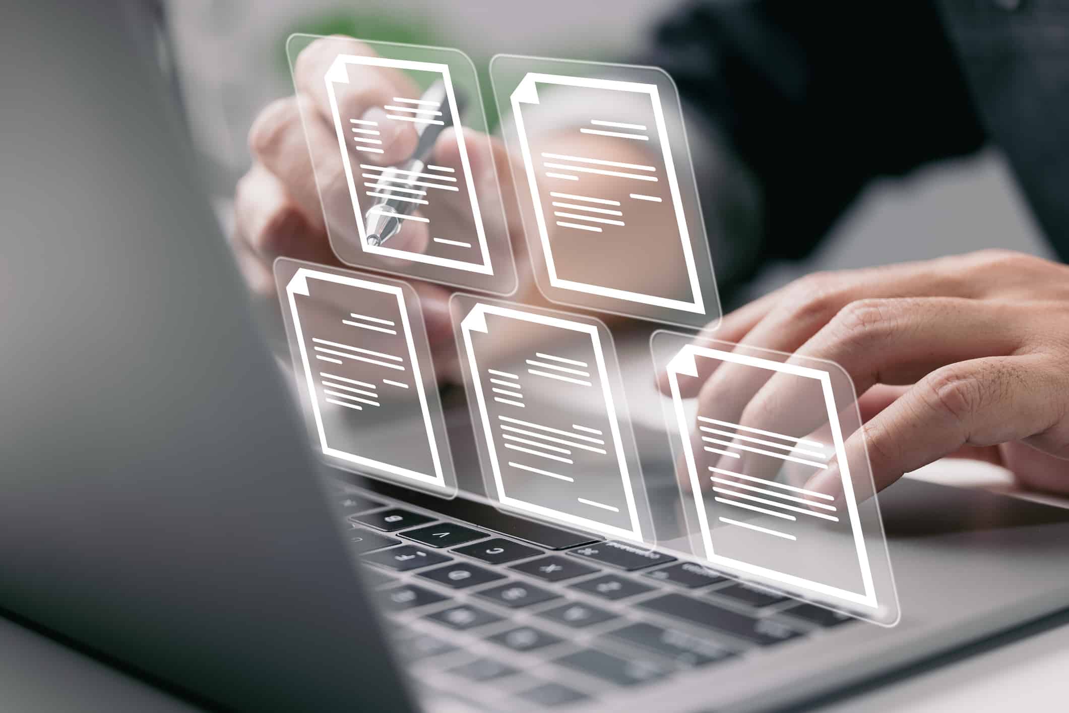 Businessman working on laptop computer with electronics document icons
