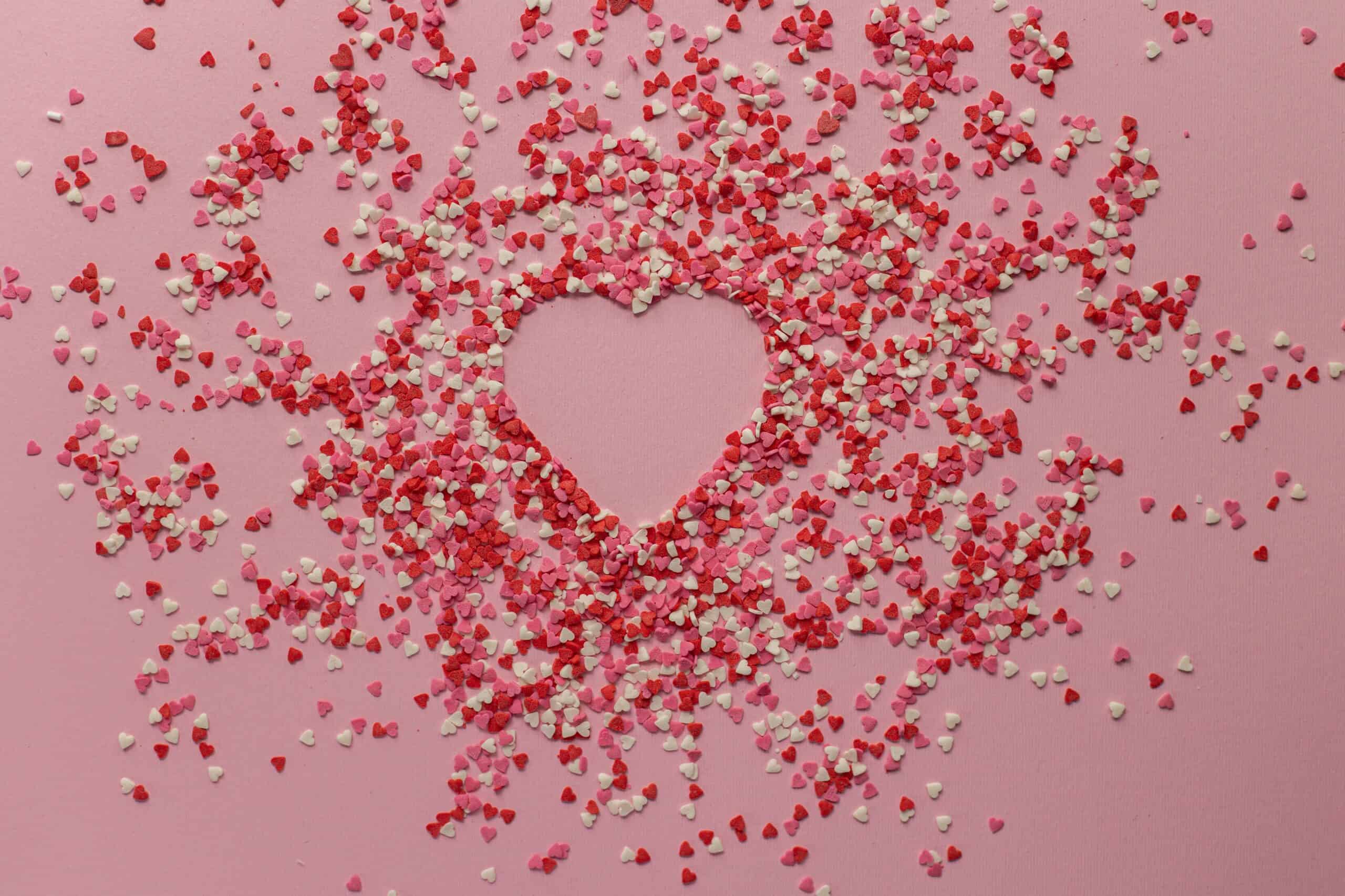 love-hearts-confetti-in-a-heart-shape|four-red-roses