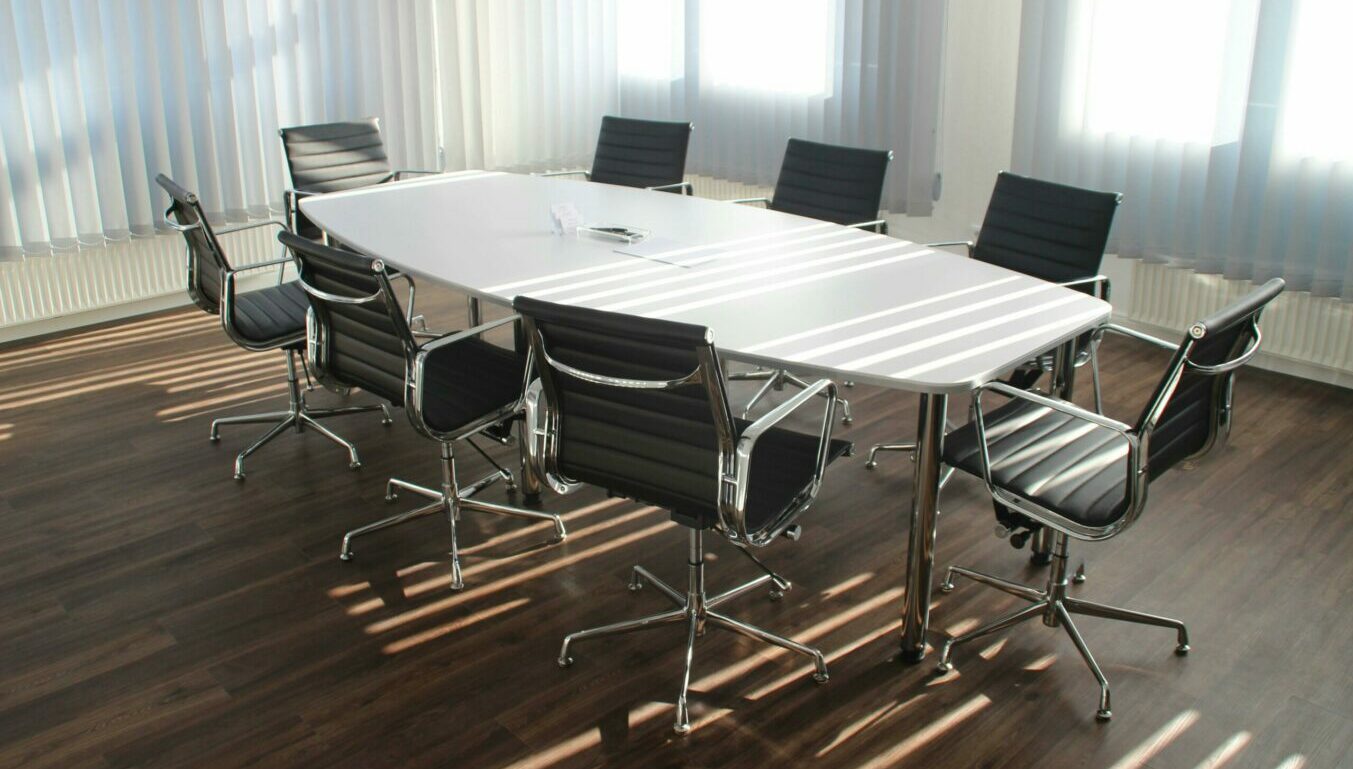 office meeting room with chairs around a table