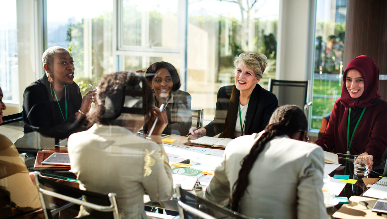 women around a table working
