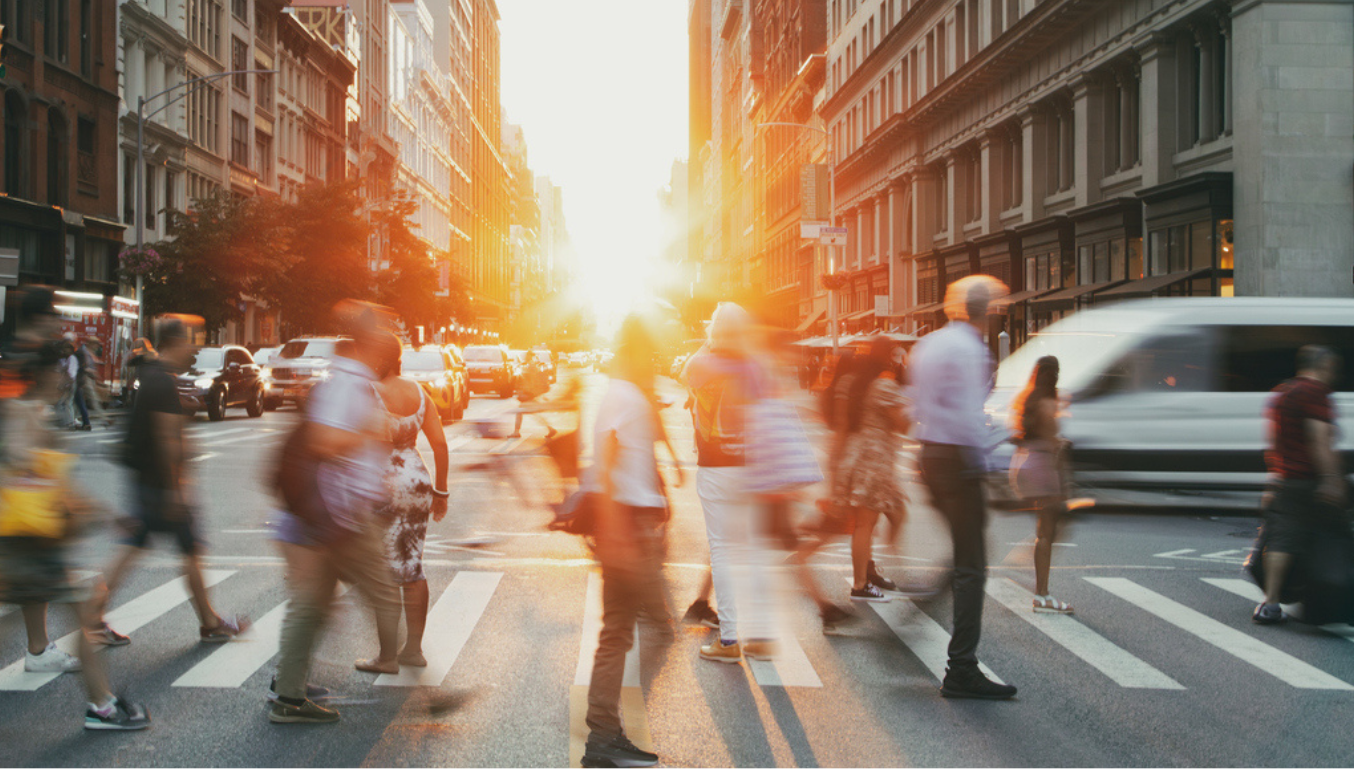 people walking on a crossing down the street - busy image