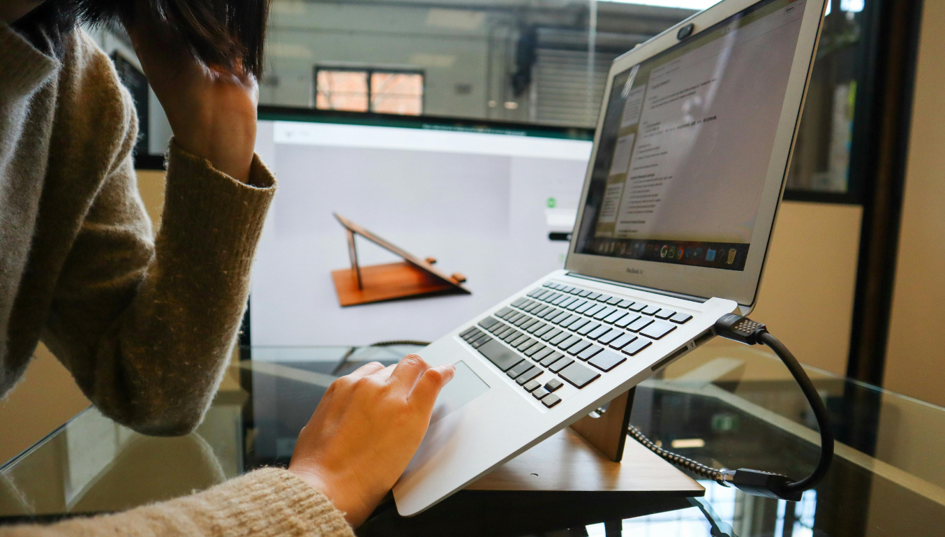 a person typing on the laptop