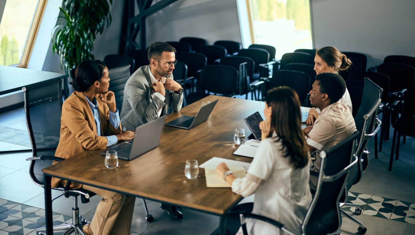 people sat around an office table