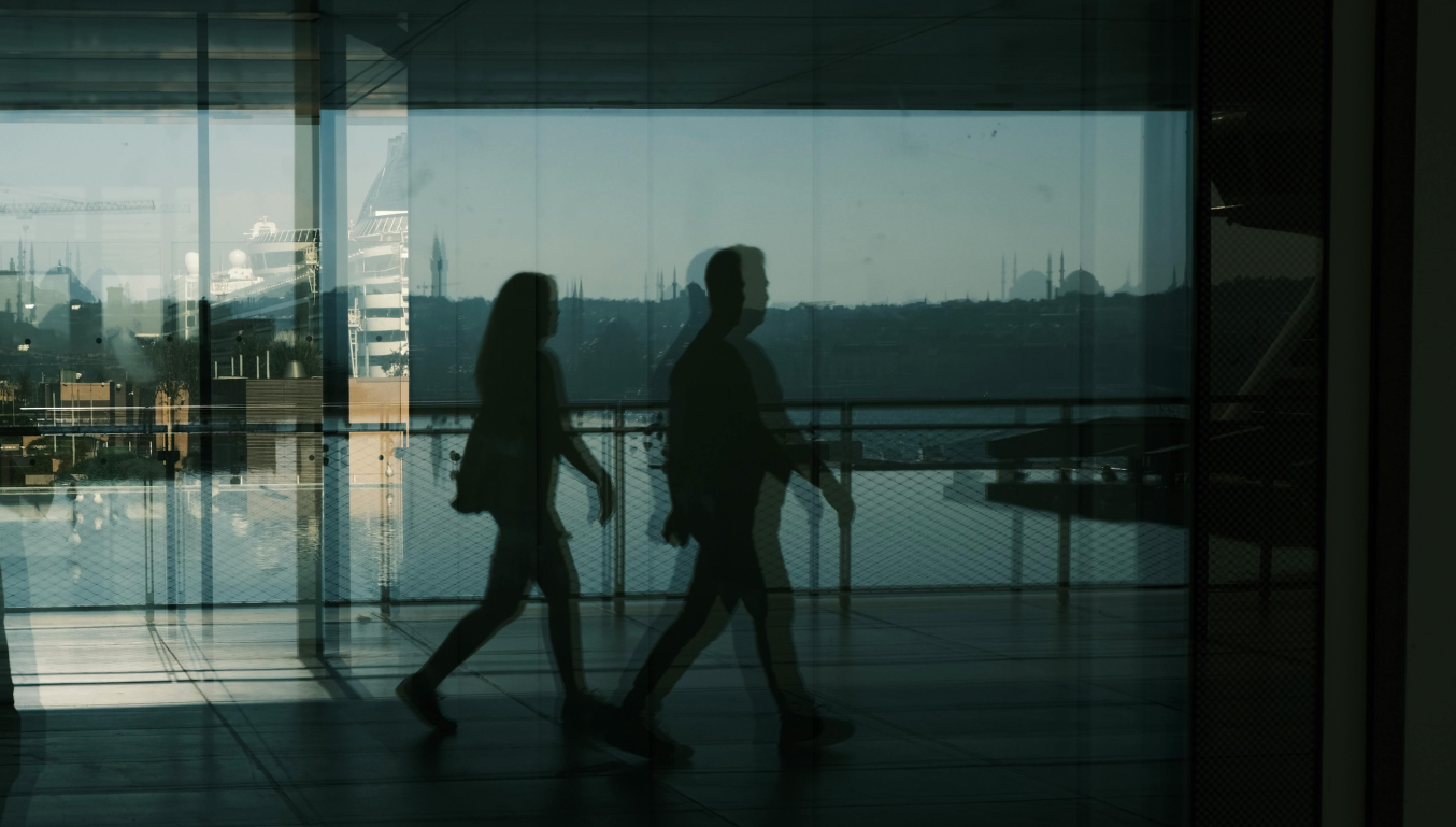 people walking - shadows away on a corridor