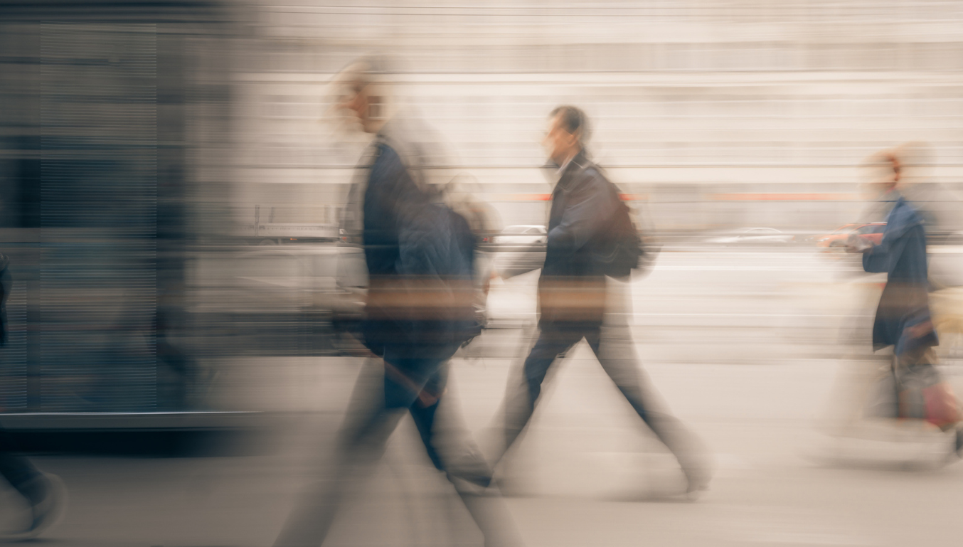 Blurred Motion Of People Walking In City