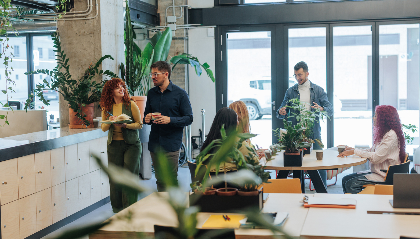Group of young colleagues taking a break in a modern office