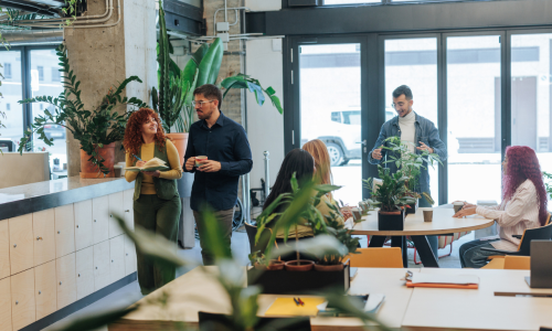 Group of young colleagues taking a break in a modern office