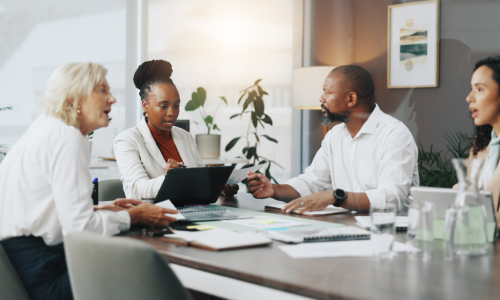 Laptop, planning and workshop with business people in office for strategy, project and research. Company growth, market report and brainstorming with employees in agency for discussion and teamwork