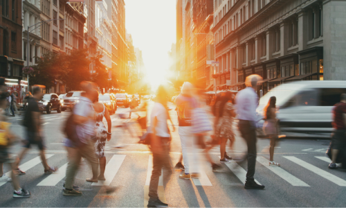 people walking on a crossing down the street - busy image