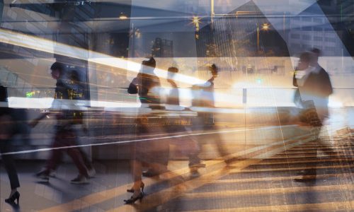 Busy city street with motion blur of people walking, fast pace lifestyle, blurred motion abstract lights.